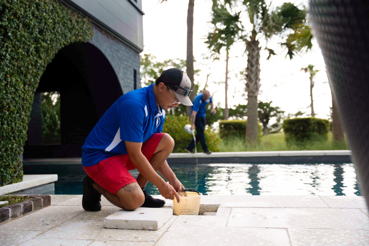 Technicians servicing a pool in West Ashley, SC